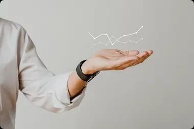 /images/aboutUs/digital-graph-with-businessman-hand-overlay 1.webp